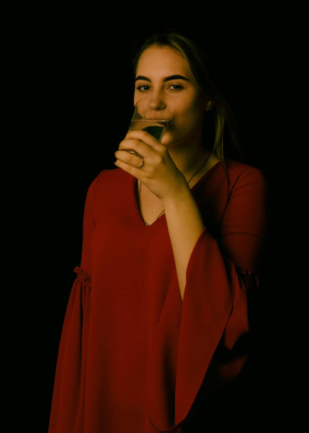 Young pretty girl drinks fresh water - Фото, изображение