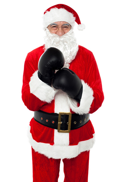 Aged cheerful Santa wearing boxing gloves - Fotografie, Obrázek
