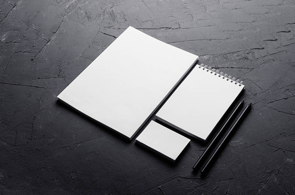 Blank stationery on elegant dark grey concrete texture. Corporate identity template. Mock up for branding, graphic designers presentations and portfolios. Top view. - 写真・画像