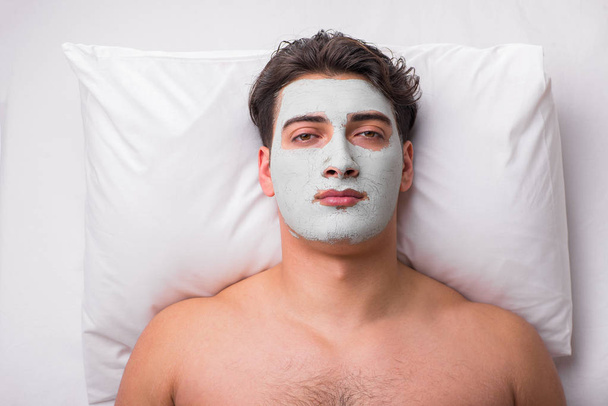 Handsome man in spa massage concept - Фото, изображение