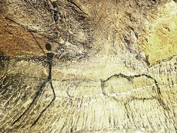 Paint of human hunting on sandstone wall, prehistoric picture. Black abstract art in sandstone cave. - Photo, Image