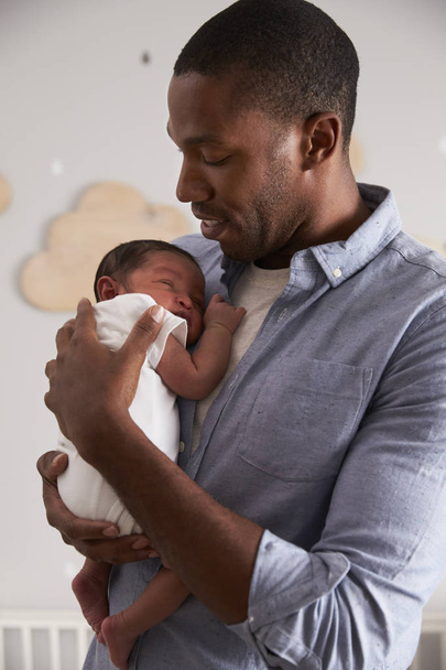 Father Holding Newborn Baby - Фото, зображення