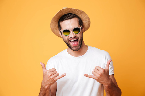 Cheerful man in summer hat looking camera - Photo, image