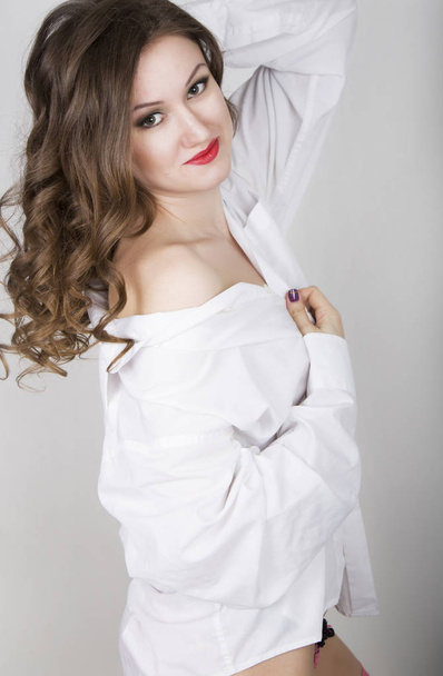 Young beautiful woman in white mens shirt - Фото, изображение