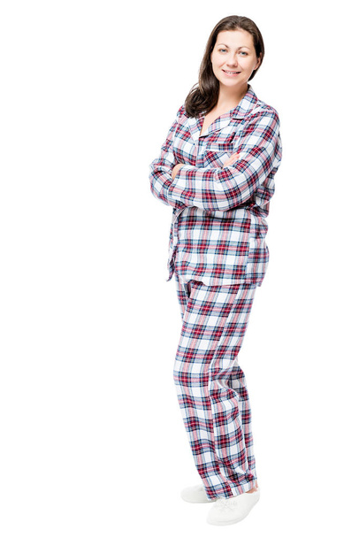 Woman in warm flannel pajamas posing in studio on white backgrou - Photo, Image