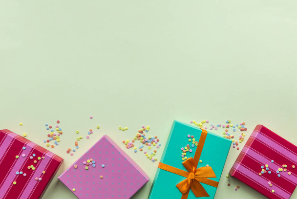 Holidays giftboxes on the pastel mint background for - 写真・画像