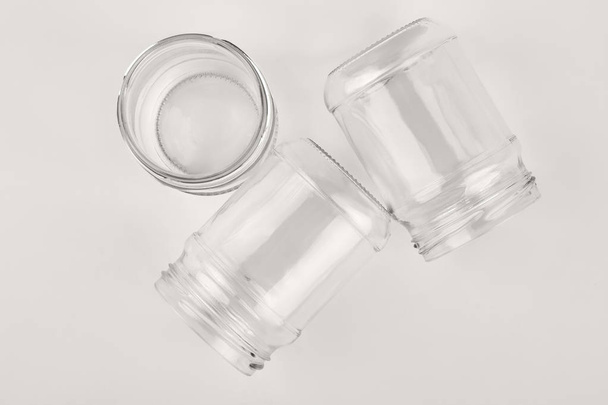 Closeup glassware containers, white background. - Foto, imagen