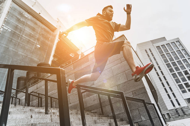 active man jumping on stairs - 写真・画像