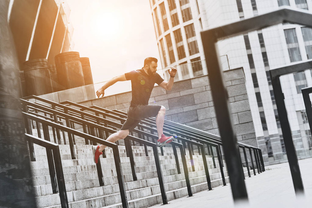 active man jumping on stairs - Photo, Image