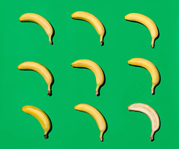 Yellow bananas on green  - Фото, зображення