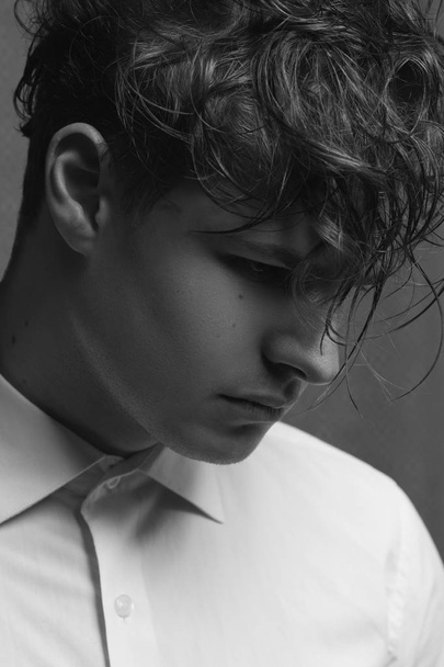 Male beauty concept. Profile portrait of young man with perfect haircut - 写真・画像