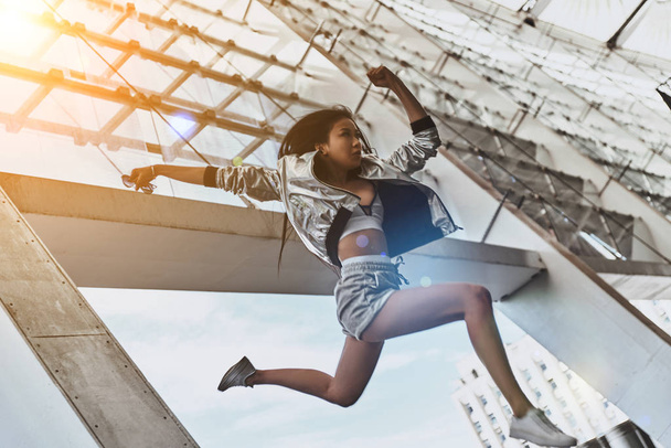 jumping asian woman - Фото, изображение