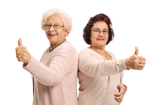 cheerful mature women holding their thumbs up - Foto, immagini