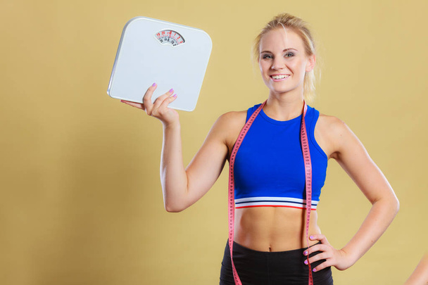 sporty happy woman with scale, weight loss - Foto, immagini