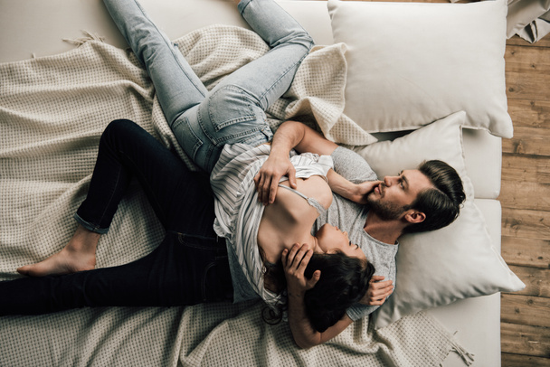 Young couple on bed  - Photo, Image