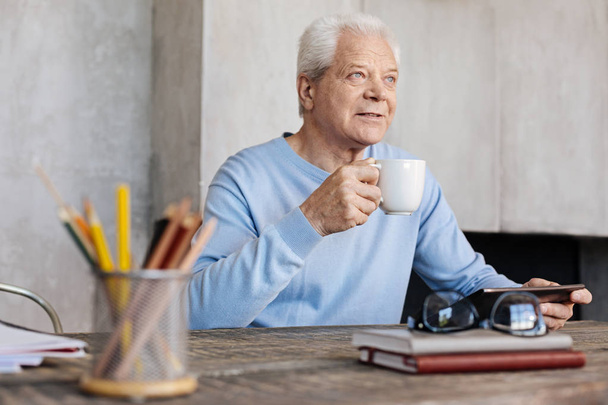 Mature inspired gentleman enjoying some coffee - Foto, afbeelding
