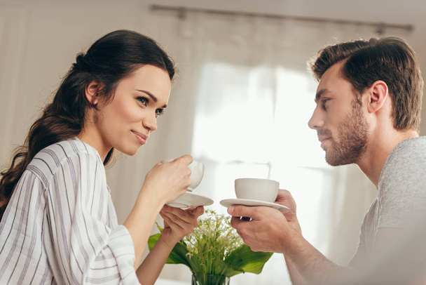 young couple drinking coffee at home - Foto, imagen
