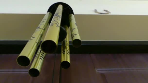 Chinese Toy Tubes Hanging Near a Door and Clinking Enigmatically in Slow Motion - Footage, Video