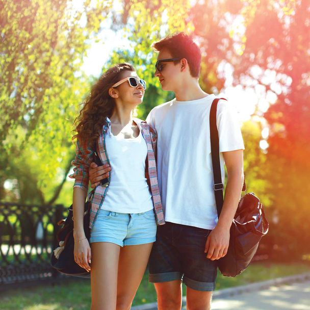 Portrait of happy young couple teenagers in a sunny summer day - Foto, imagen