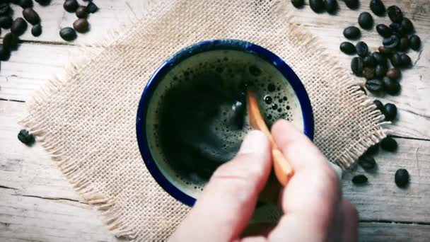  moves teaspoon into cup coffee - Footage, Video