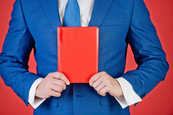 business man with red book in hand, marketing - Photo, Image