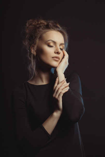 Dramatic portrait of young brunette model with closed eyes - Photo, Image