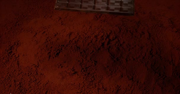 Chocolate Tablet falling on Chocolate Powder - Filmati, video