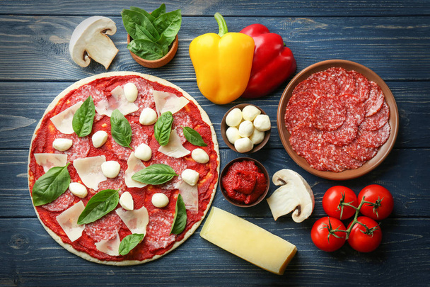 Tasty pizza with ingredients  - Photo, Image