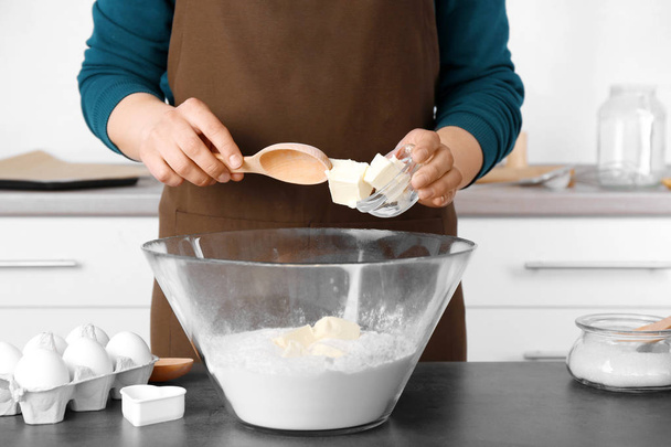 Woman making dough for butter cookies - Photo, image