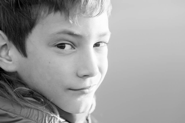 outdoor portrait of young happy smiling teen boy - Фото, изображение