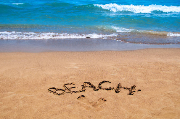 Inscription beach on the sand. Beach season. Rest on the sea - Foto, immagini