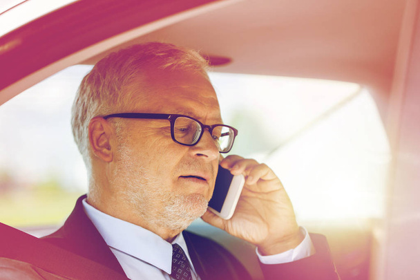senior businessman calling on smartphone in car - Φωτογραφία, εικόνα
