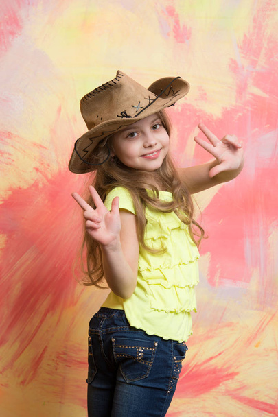 happy child or little smiling girl in cowboy hat - Fotó, kép