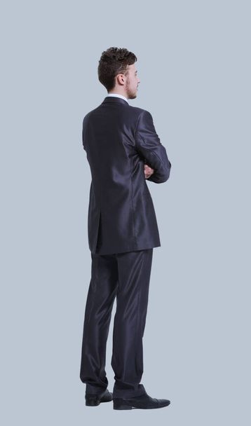 Young  business man full body side view isolated on gray backgro - Foto, immagini