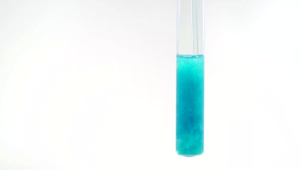 Interaction of solutions of sodium hydroxide and copper II sulfate. The formation of a blue precipitate of copper II hydroxide. - Footage, Video