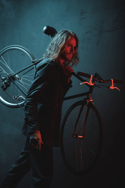 Young man with bicycle  - Valokuva, kuva