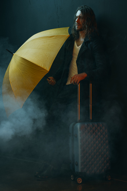 Young man with suitcase  - Zdjęcie, obraz