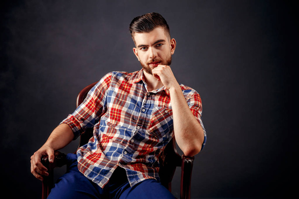 Portrait of bearded male with long hair over dark background. - Fotografie, Obrázek