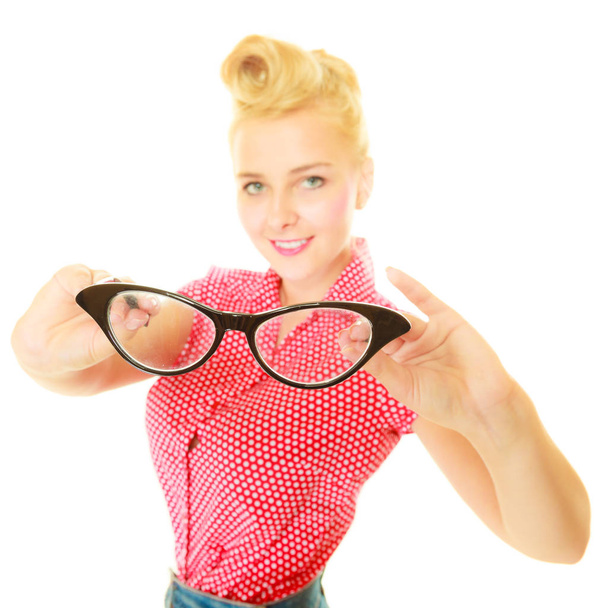 Blonde pin up girl holding retro glasses - Фото, изображение