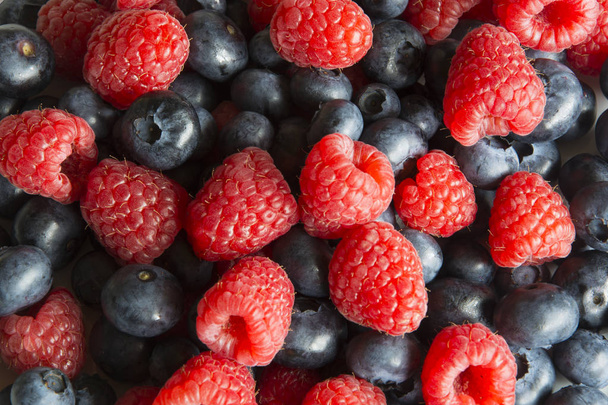 A Serving of Raspberries and Blueberries - Photo, Image