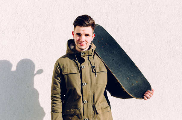 Young Man With Skateboard - Фото, зображення