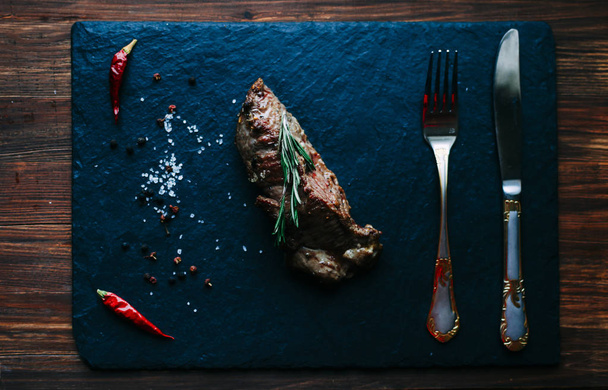 Meat steak with rosemary - Foto, imagen