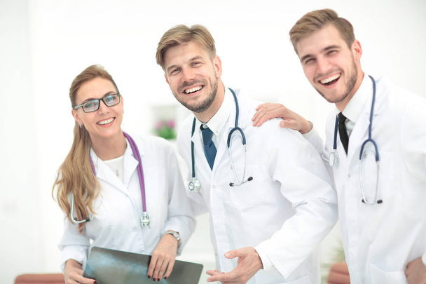 Portrait of confident happy group of doctors working at the medi - 写真・画像