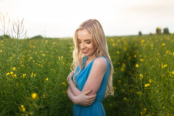 Young beautiful woman in the fields - Fotografie, Obrázek