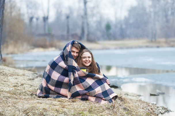 Love story of Beautiful happy couple on lake, spring forest. - Foto, Imagen