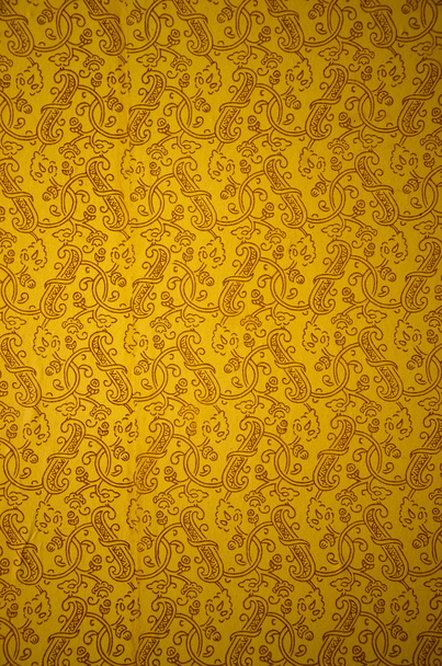 Ancient yellow and ornamental wallpaper background - Photo, Image