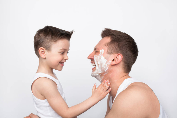 man in shaving foam with son  - Φωτογραφία, εικόνα