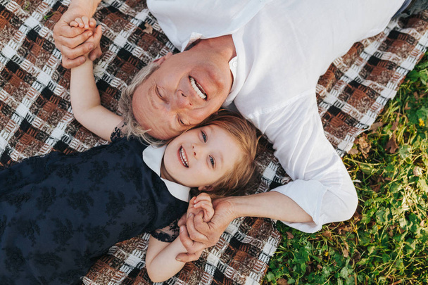 Laughing man with little granddaughter - Fotografie, Obrázek