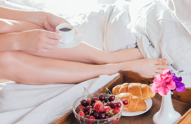 Woman having breakfast in bed - Photo, Image