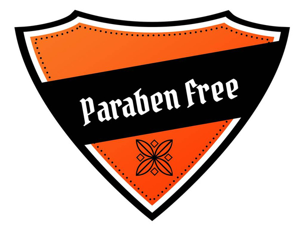 Помаранчевий і чорний щит з текстом PARABEN FREE
. - Фото, зображення